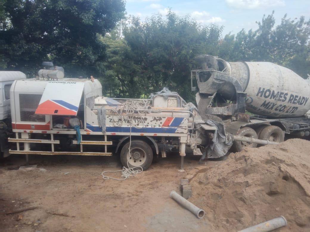 Our ready-mix concrete being transported and applied, demonstrating efficient construction practices.
