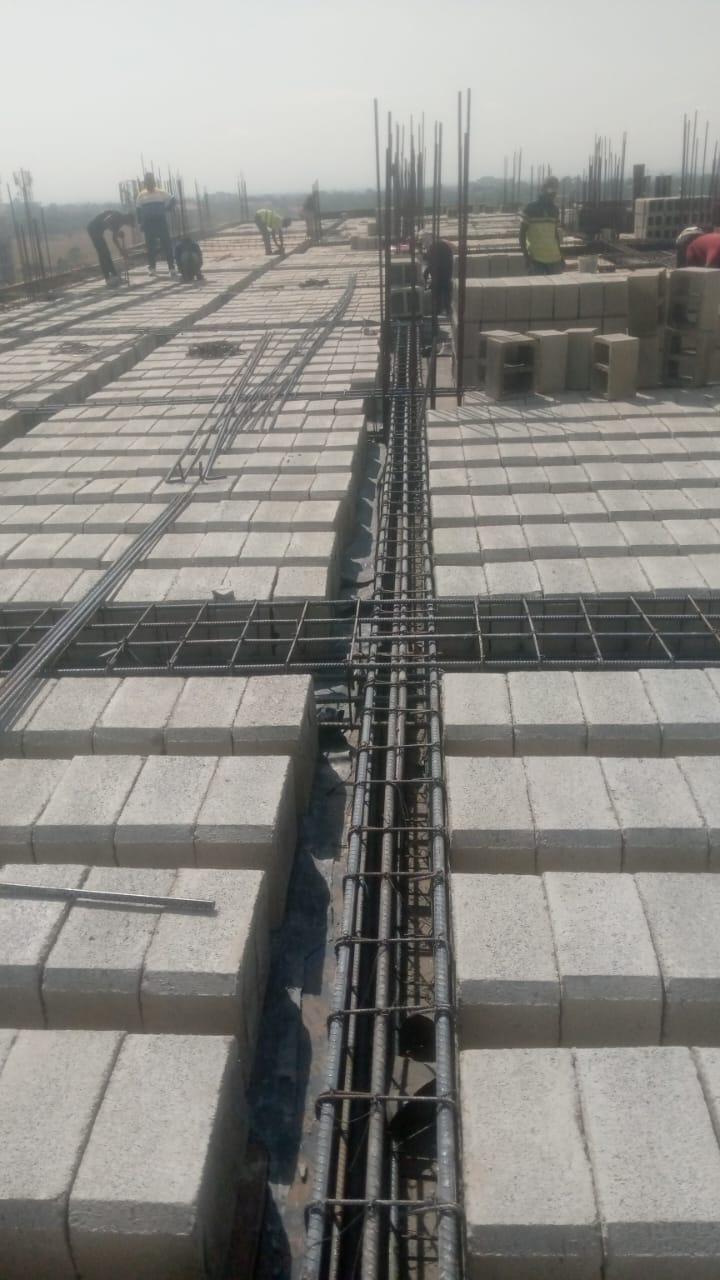 Concrete being prepared and handled with care, illustrating the process from batching to placement.