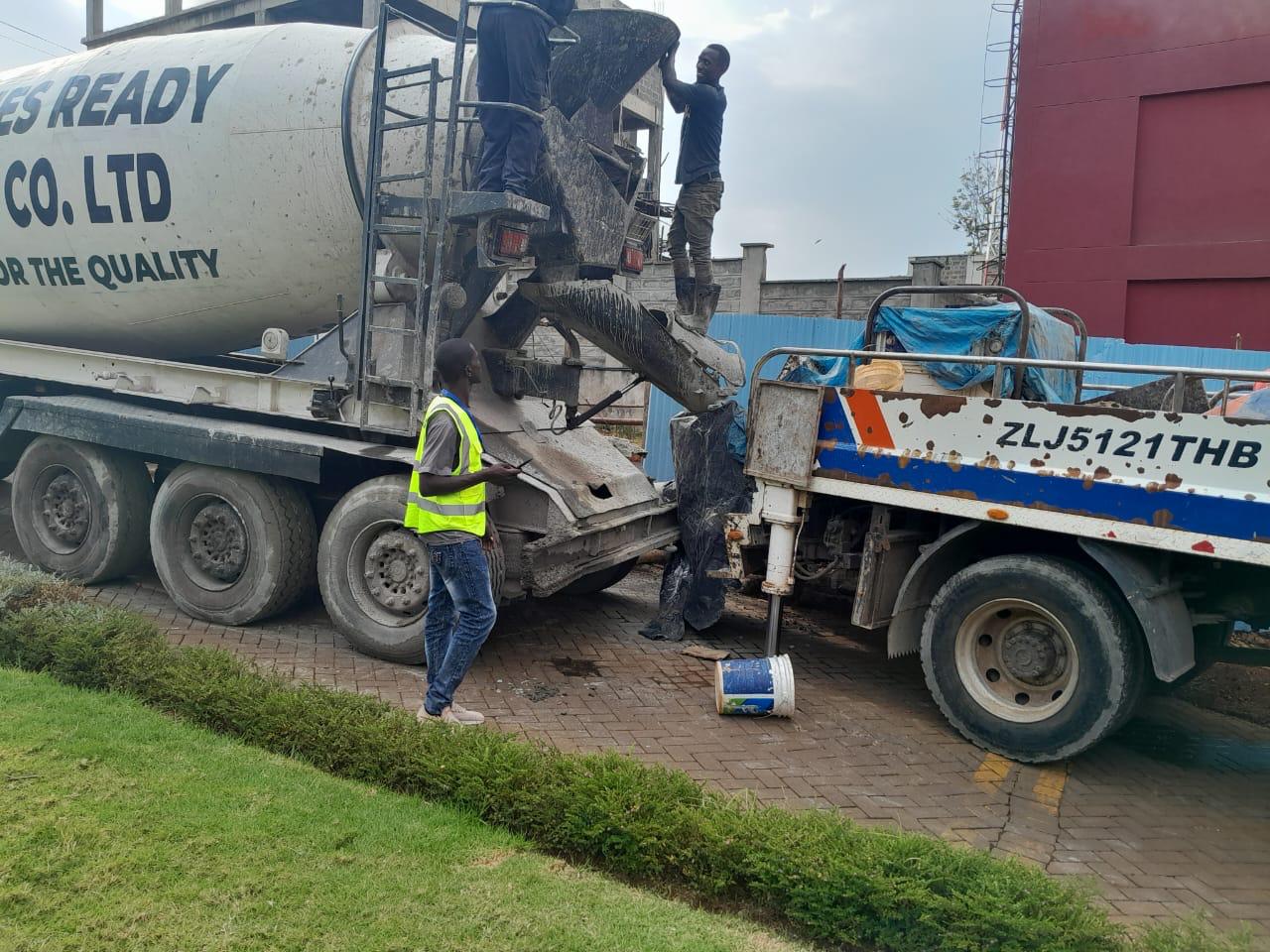 Images capturing the process of concrete pouring and site preparation for various projects.