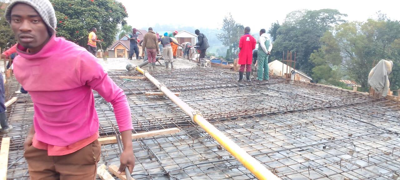 Concrete being prepared and handled with care, illustrating the process from batching to placement.