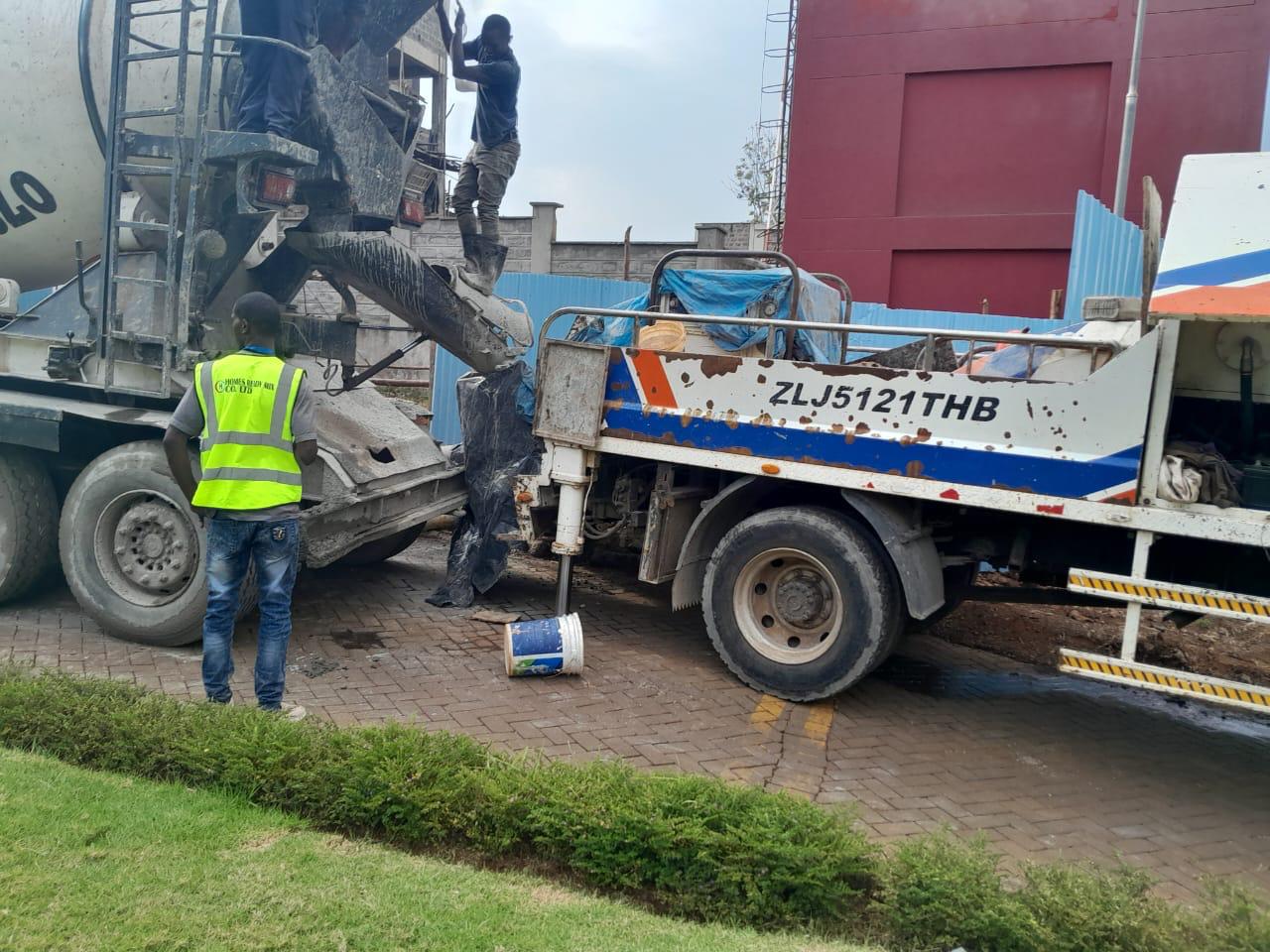 Concrete being prepared and handled with care, illustrating the process from batching to placement.