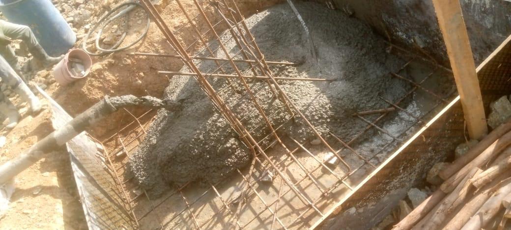 Images capturing the process of concrete pouring and site preparation for various projects.