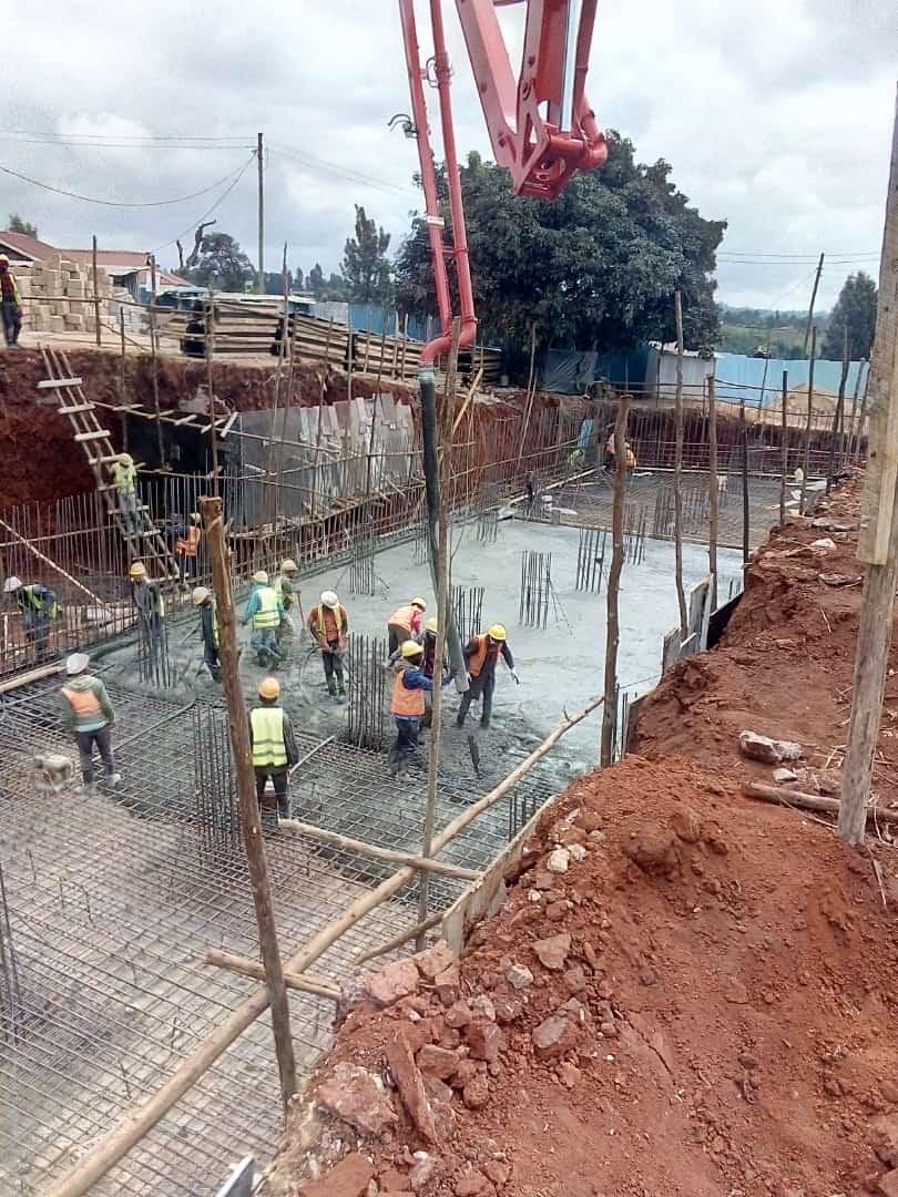 Our ready-mix concrete being transported and applied, demonstrating efficient construction practices.