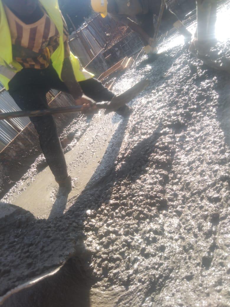 Our ready-mix concrete being transported and applied, demonstrating efficient construction practices.