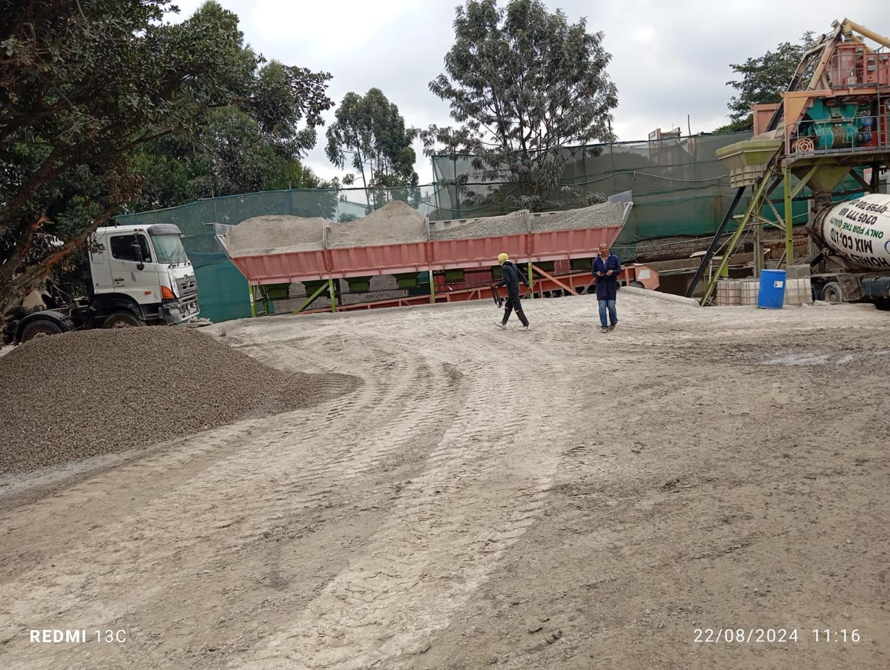Images capturing the process of concrete pouring and site preparation for various projects.