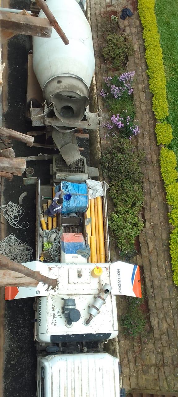 Concrete being prepared and handled with care, illustrating the process from batching to placement.