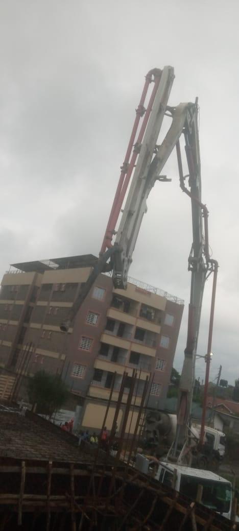 Our ready-mix concrete being transported and applied, demonstrating efficient construction practices.