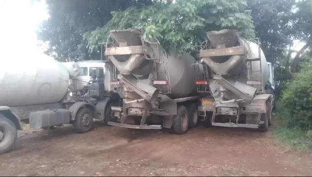Concrete being prepared and handled with care, illustrating the process from batching to placement.