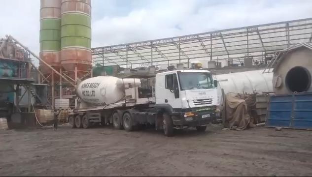 Concrete being prepared and handled with care, illustrating the process from batching to placement.