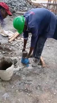 Concrete being prepared and handled with care, illustrating the process from batching to placement.