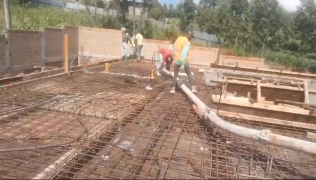 Our ready-mix concrete being transported and applied, demonstrating efficient construction practices.