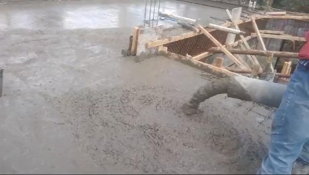 Our ready-mix concrete being transported and applied, demonstrating efficient construction practices.