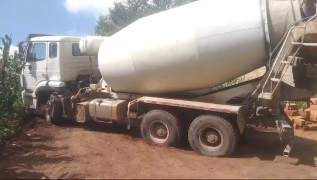 Images capturing the process of concrete pouring and site preparation for various projects.