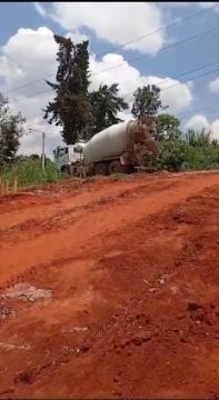 Images capturing the process of concrete pouring and site preparation for various projects.