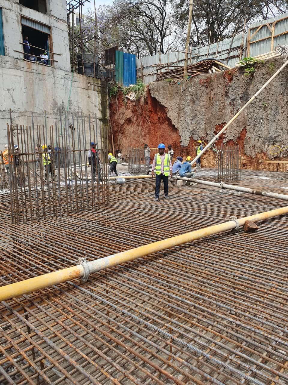Concrete being prepared and handled with care, illustrating the process from batching to placement.